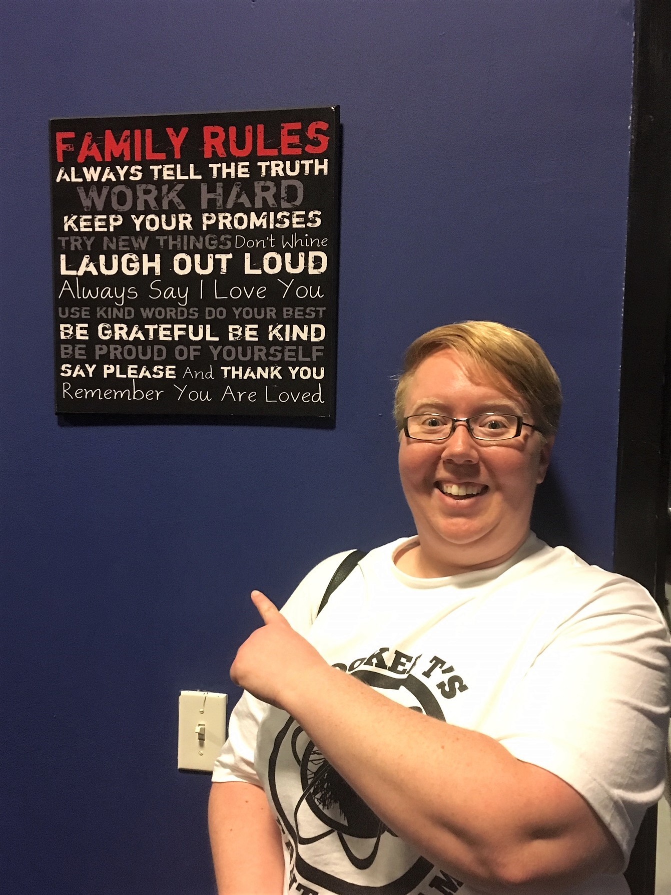 Me posing with the Family Rules plaque!